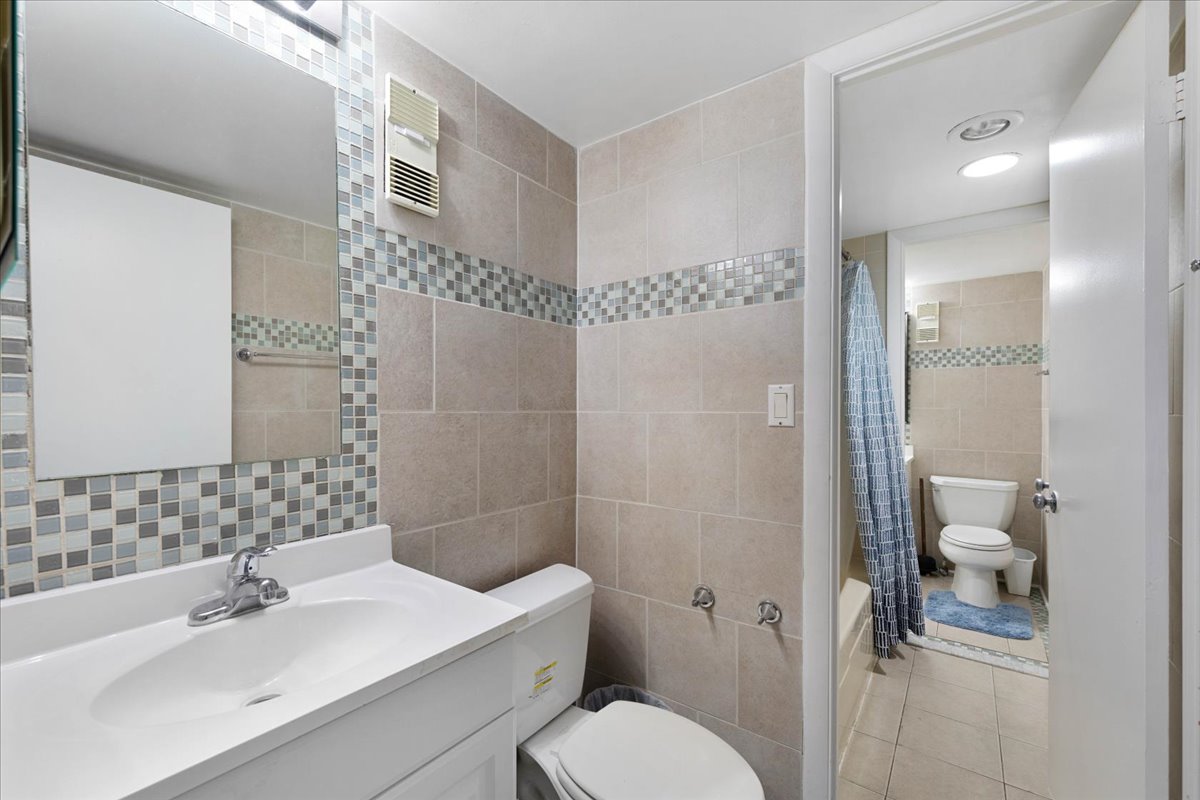 You'll Love the Updated, Custom Tile Bathrooms!