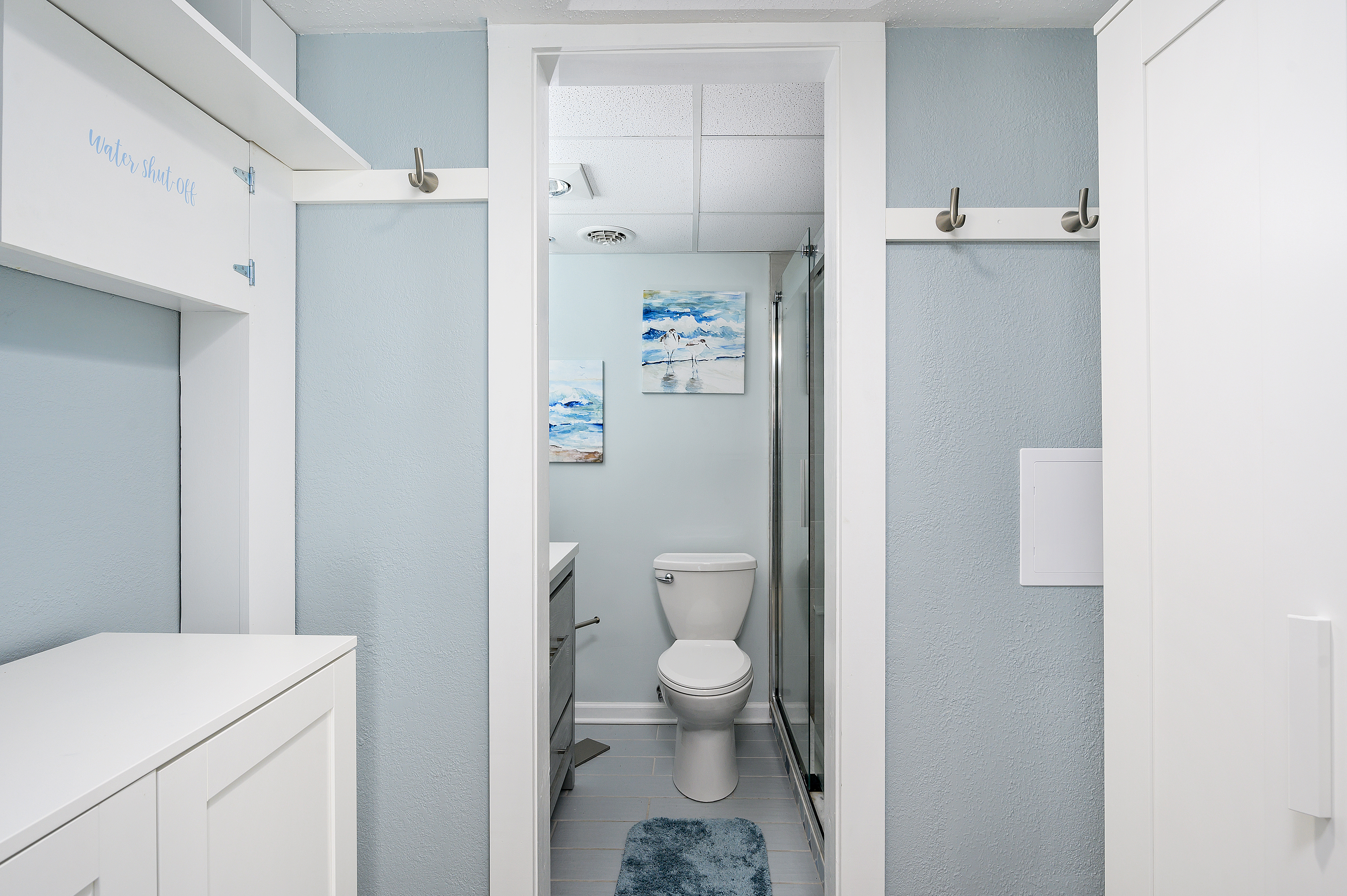The attached bathroom in Bedroom 1 is complete with stand-up glass shower