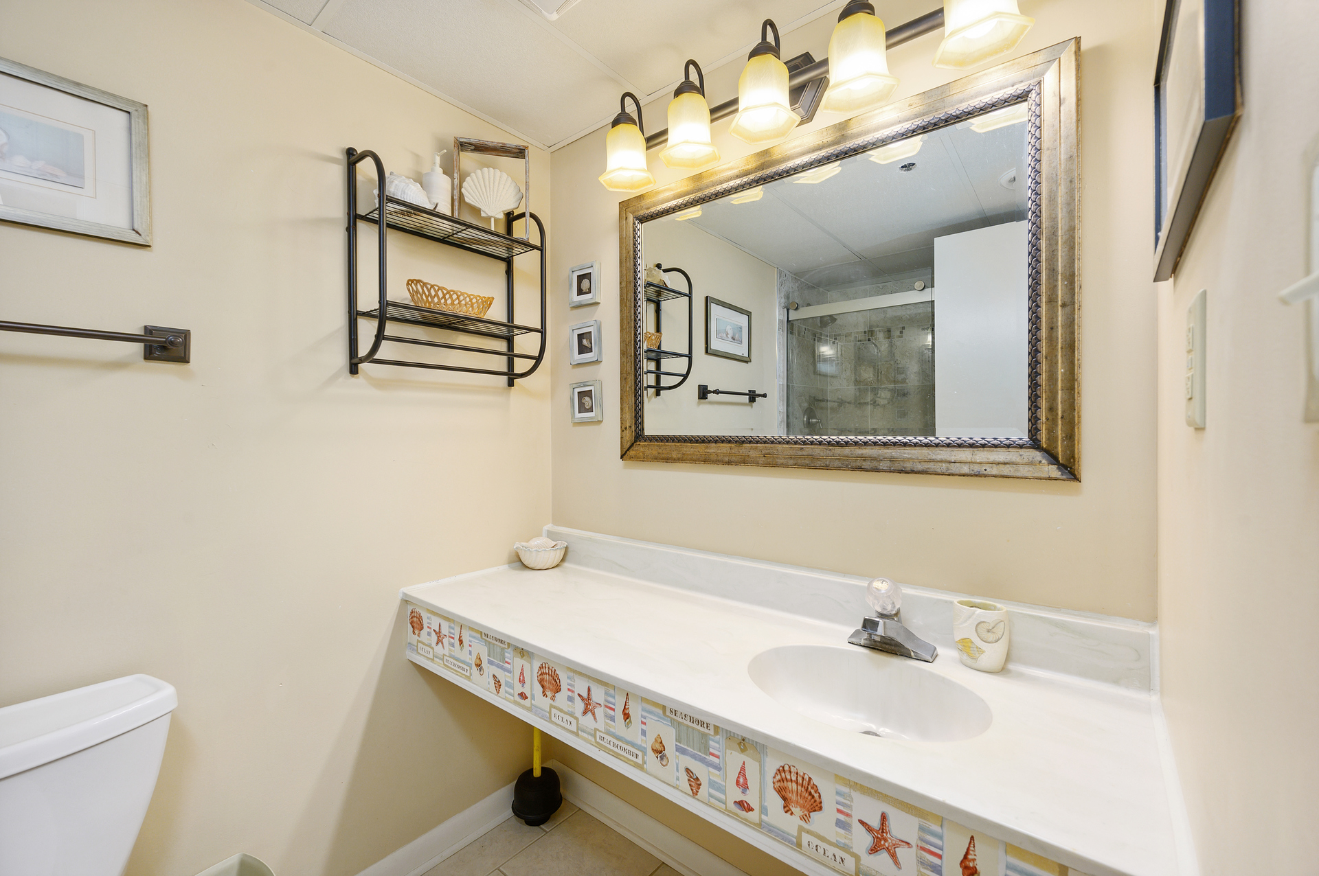 Beautiful tiles decorate the large sink and counter space.