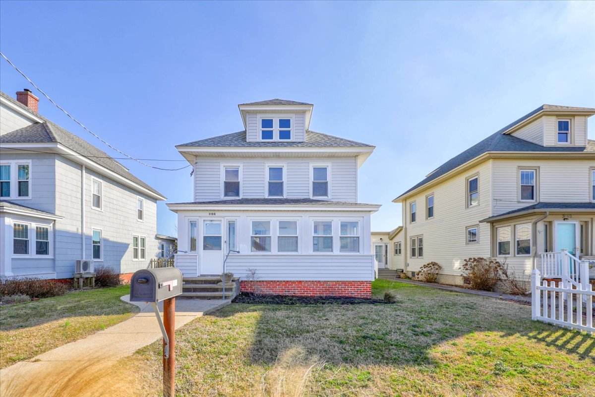A wonderful Sun Porch lines the front of the house directly facing the Chincoteague Bay.