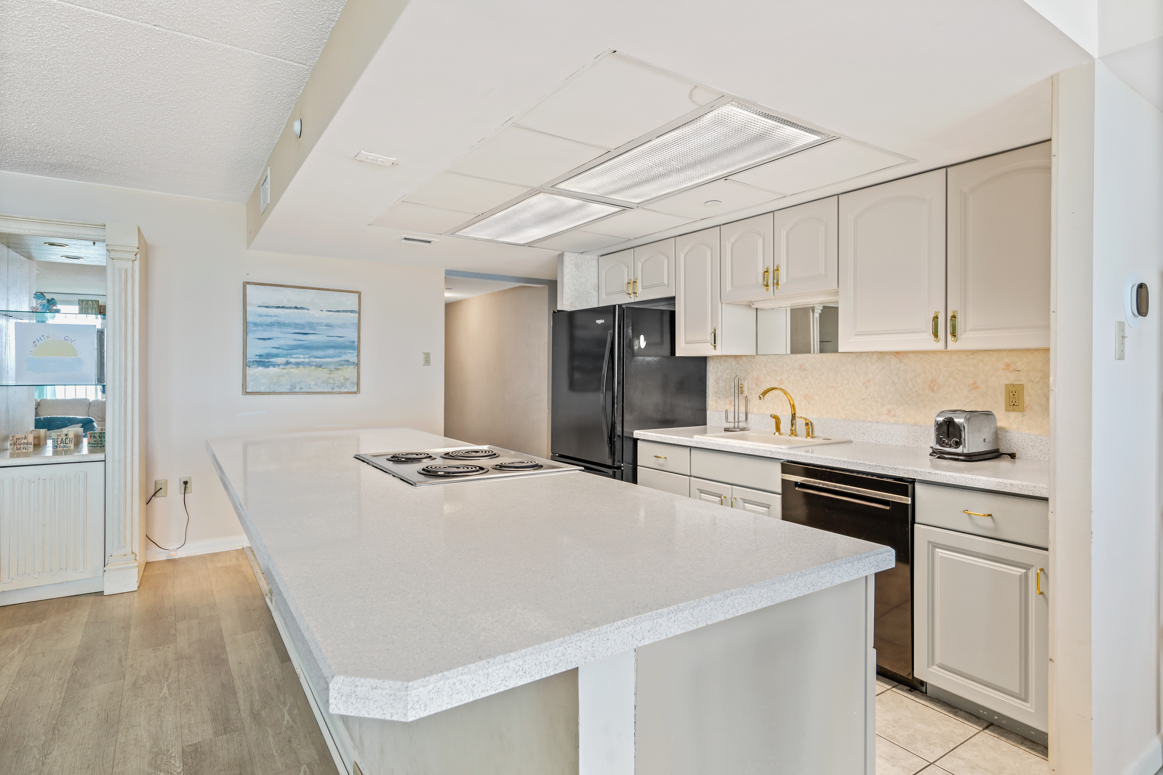 The kitchen comes equipped with all the major appliances.