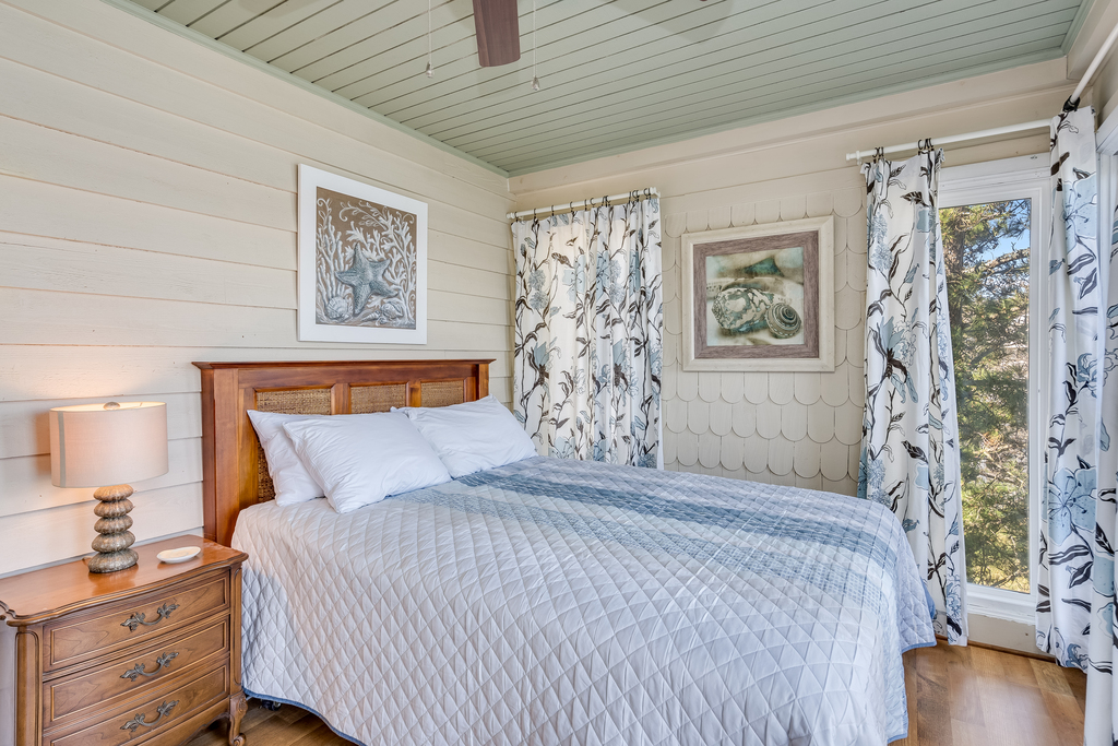 Bedroom 1 has a comfy Queen Bed and serene Coastal Colors.