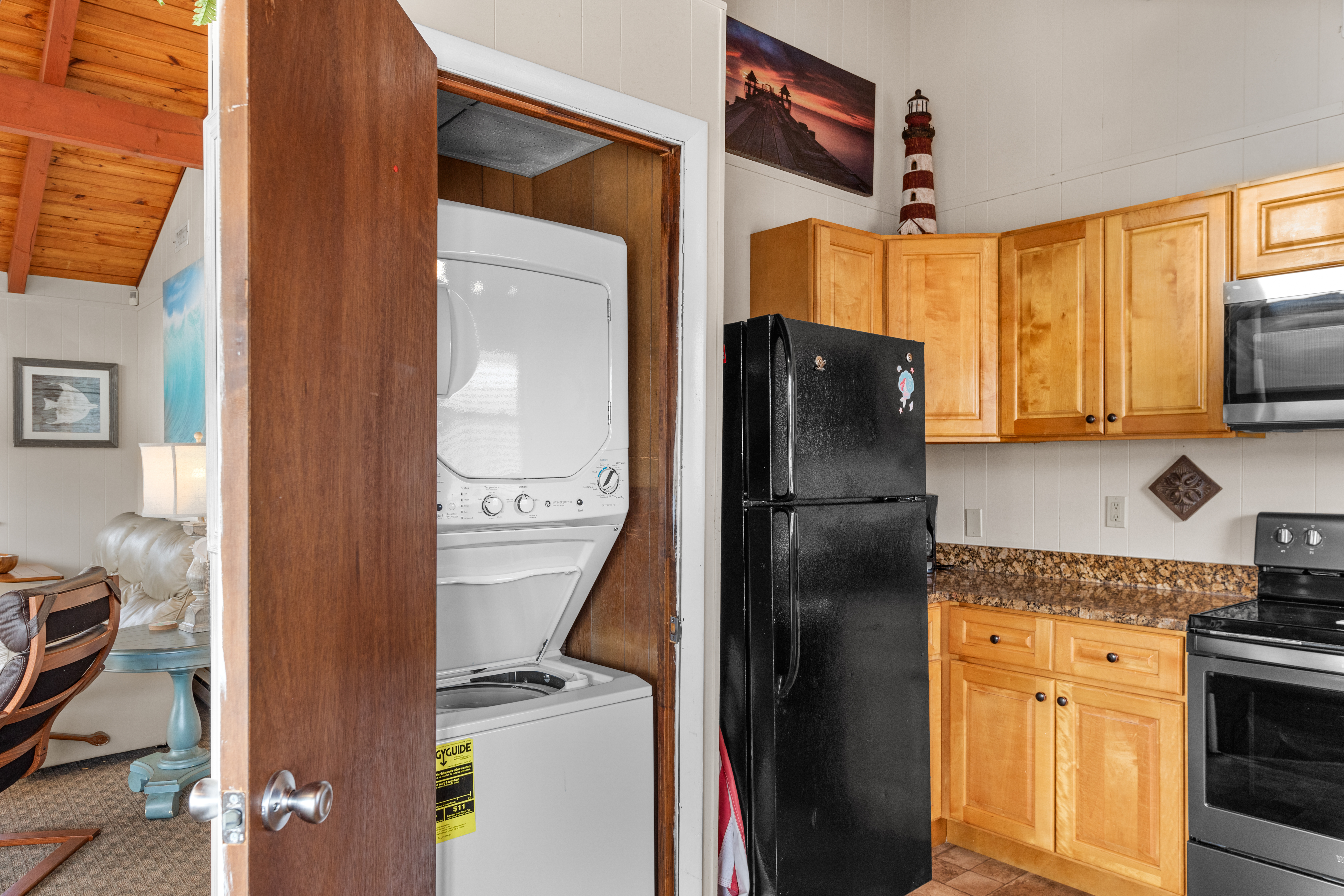 You'll be thrilled to find a Laundry Closet with Washer and Dryer in the Kitchen.