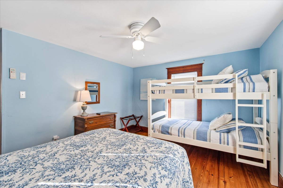 Bedroom 2 sleeps 4 and is dressed in beachy blues.