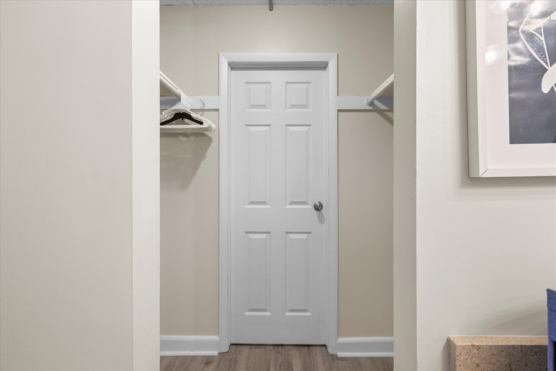 The Primary Bedroom Closet has plenty of space to make yourself at Home.