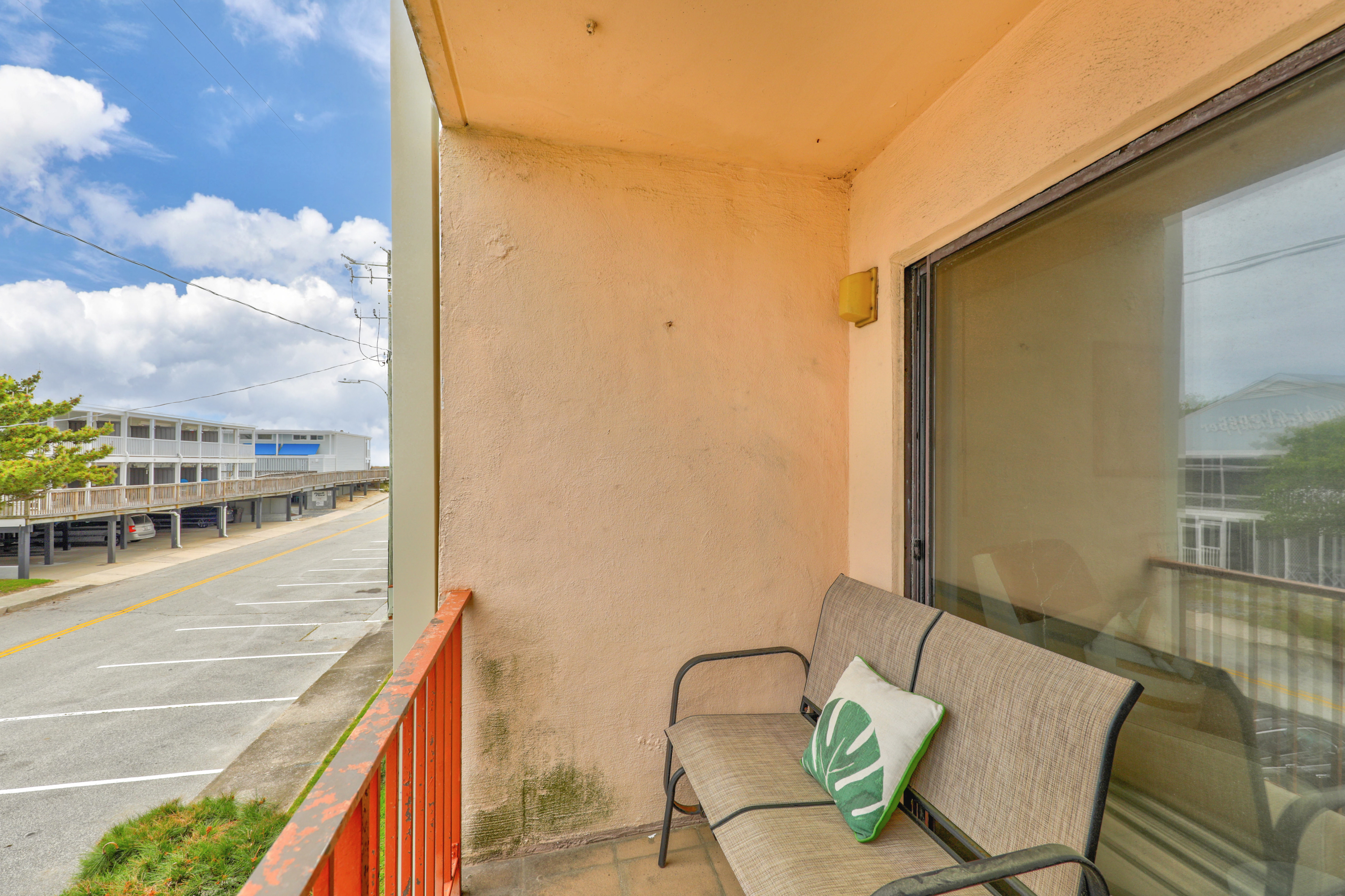 Enjoy your morning cup of coffee and ocean air on this open balcony