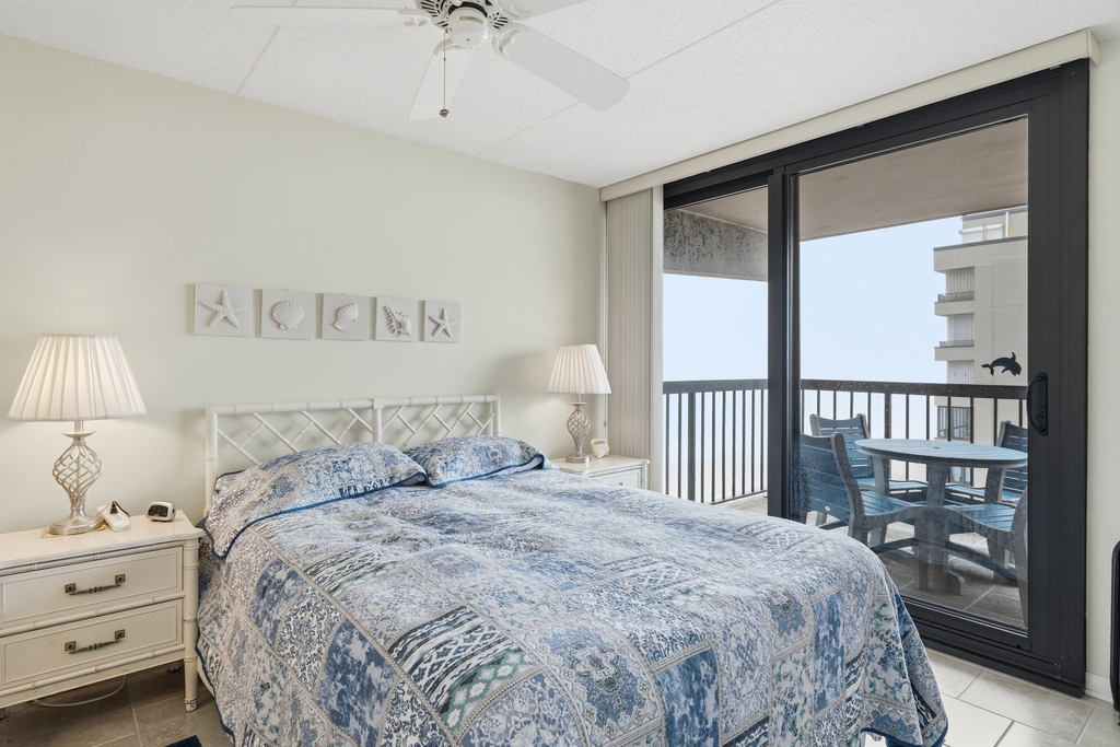 Check out this serene Primary Bedroom with balcony access overlooking the ocean.