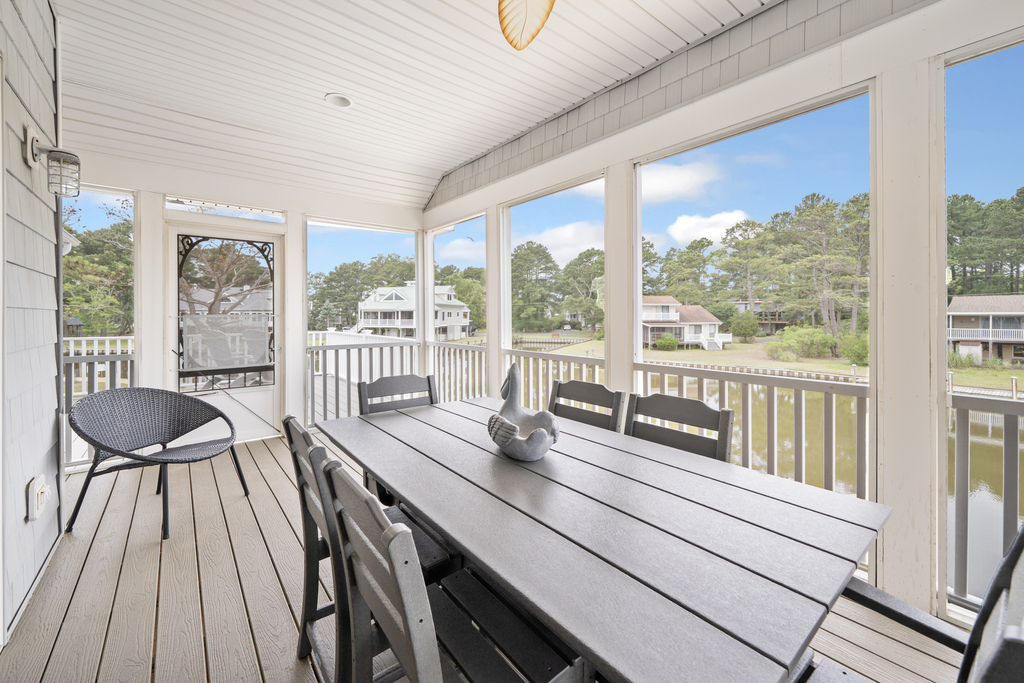 Dine Al Fresco at the water's edge on the Waterfront Screened Porch.