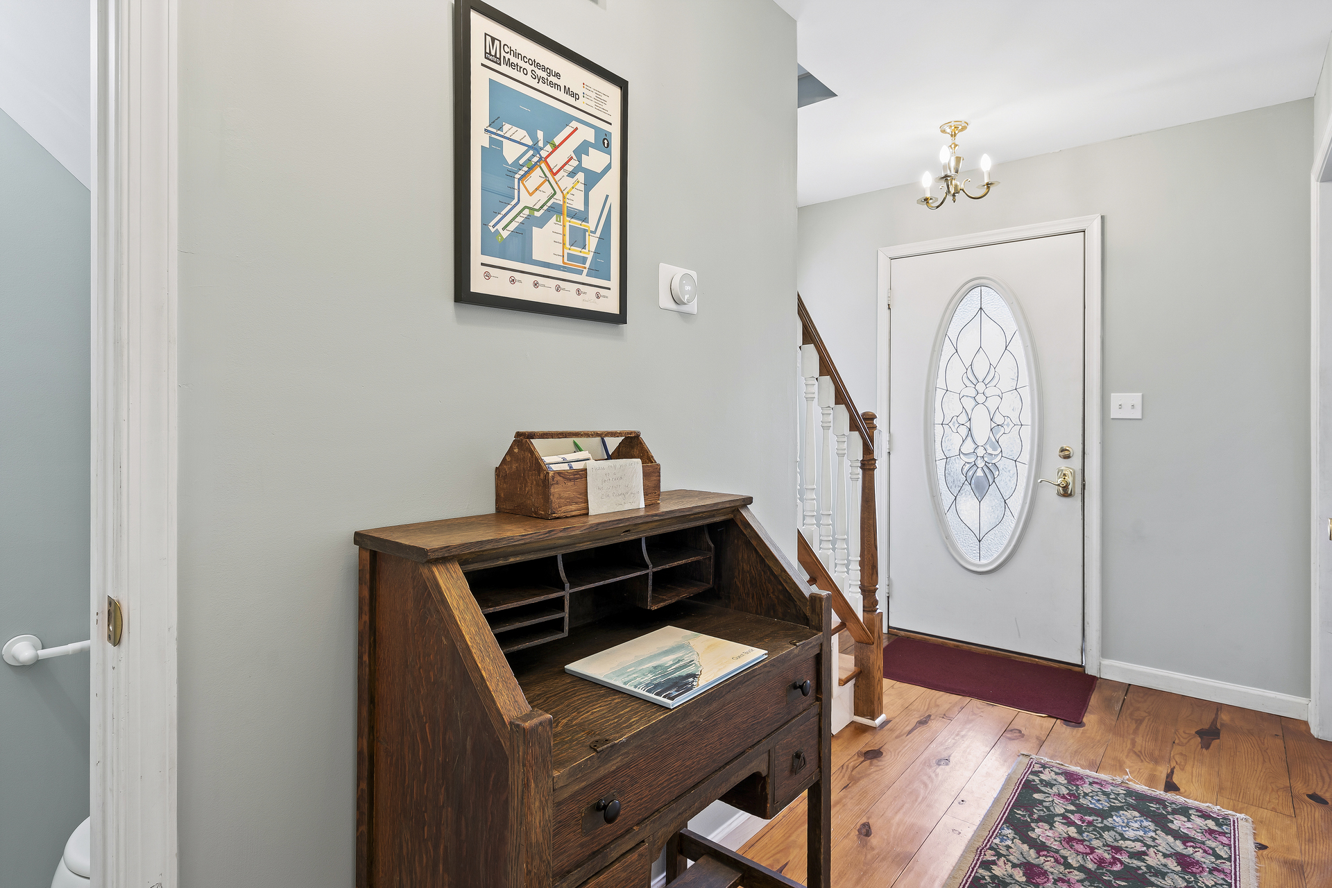 You will be welcomed by a gorgeous foyer with Antique Furnishings and gleaming Hardwood Floors.