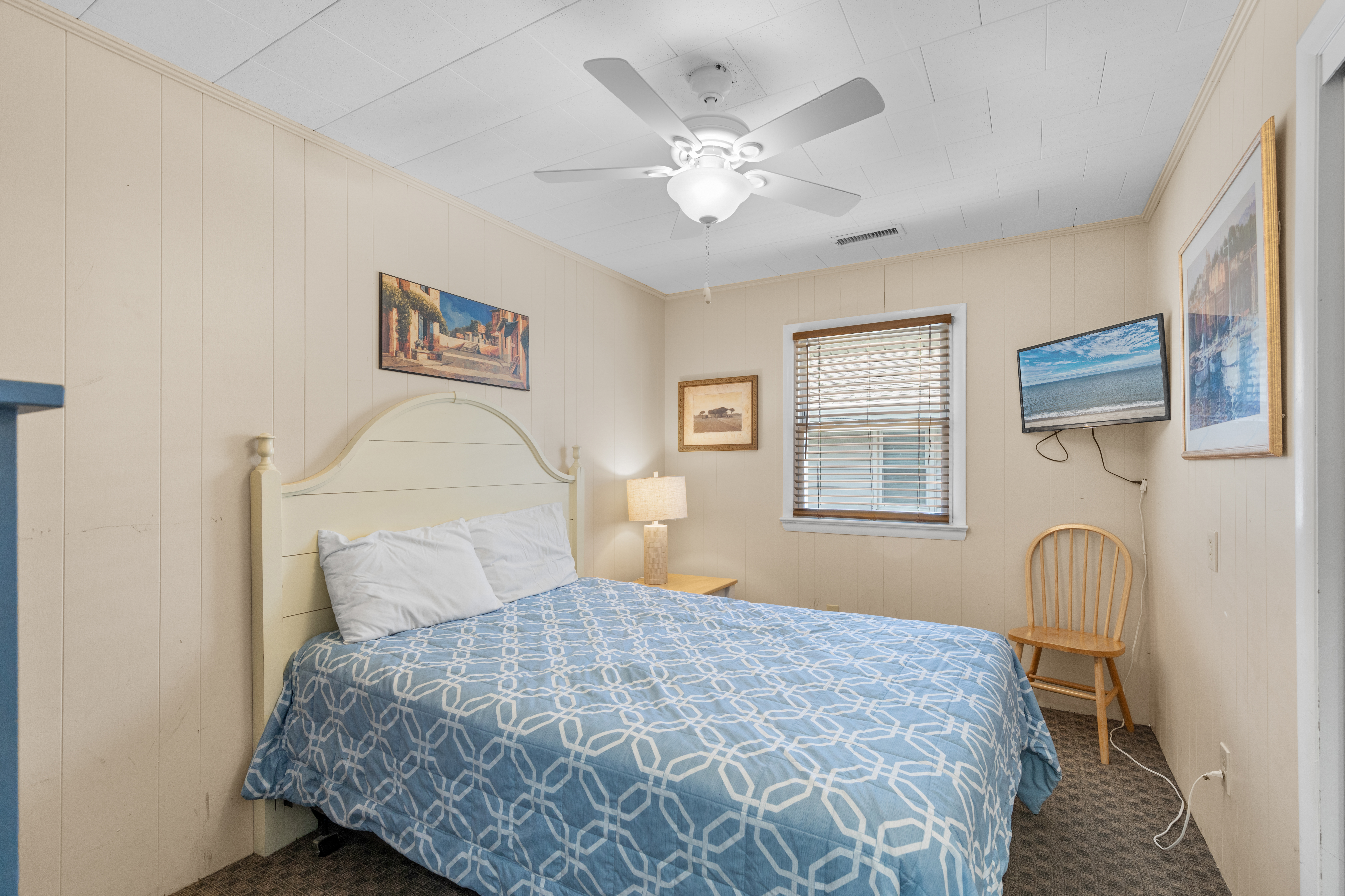 The Bedroom features a Cozy Queen Bed.