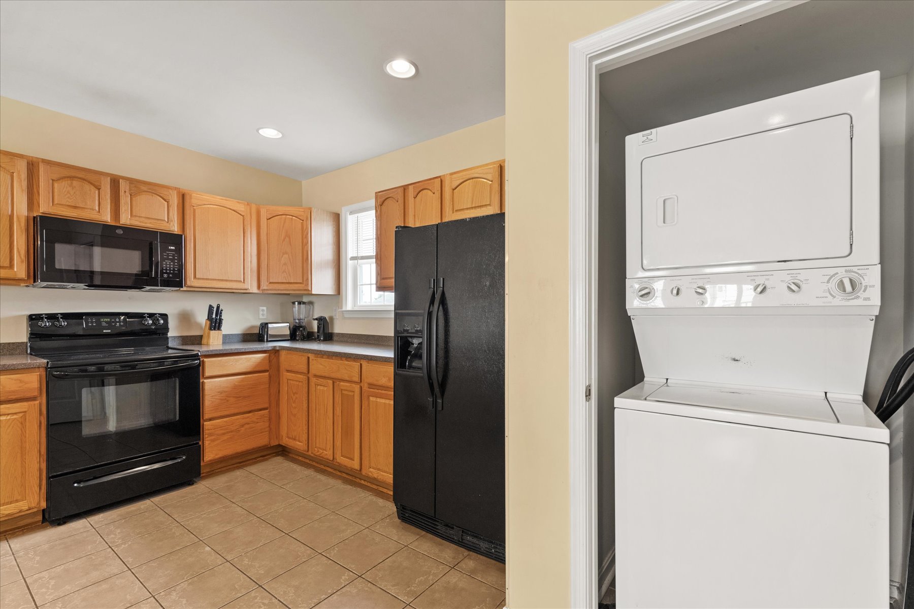 Right off the Kitchen is a stacked Washer/Dryer for your use!