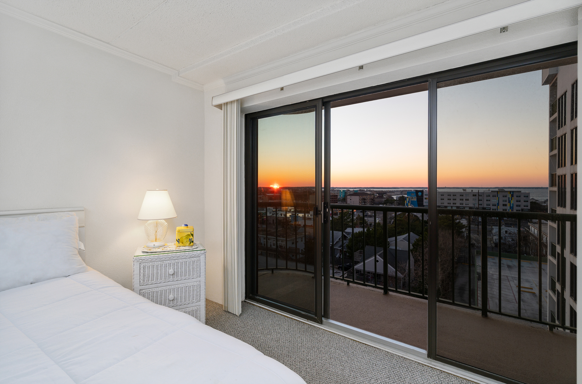 Slip out to the Private Balcony and catch the Sun Set over the Bay.