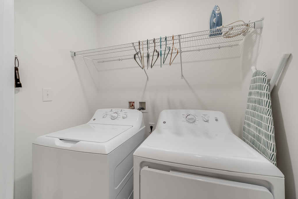 Upstairs Laundry with Full Size Washer and Dryer.