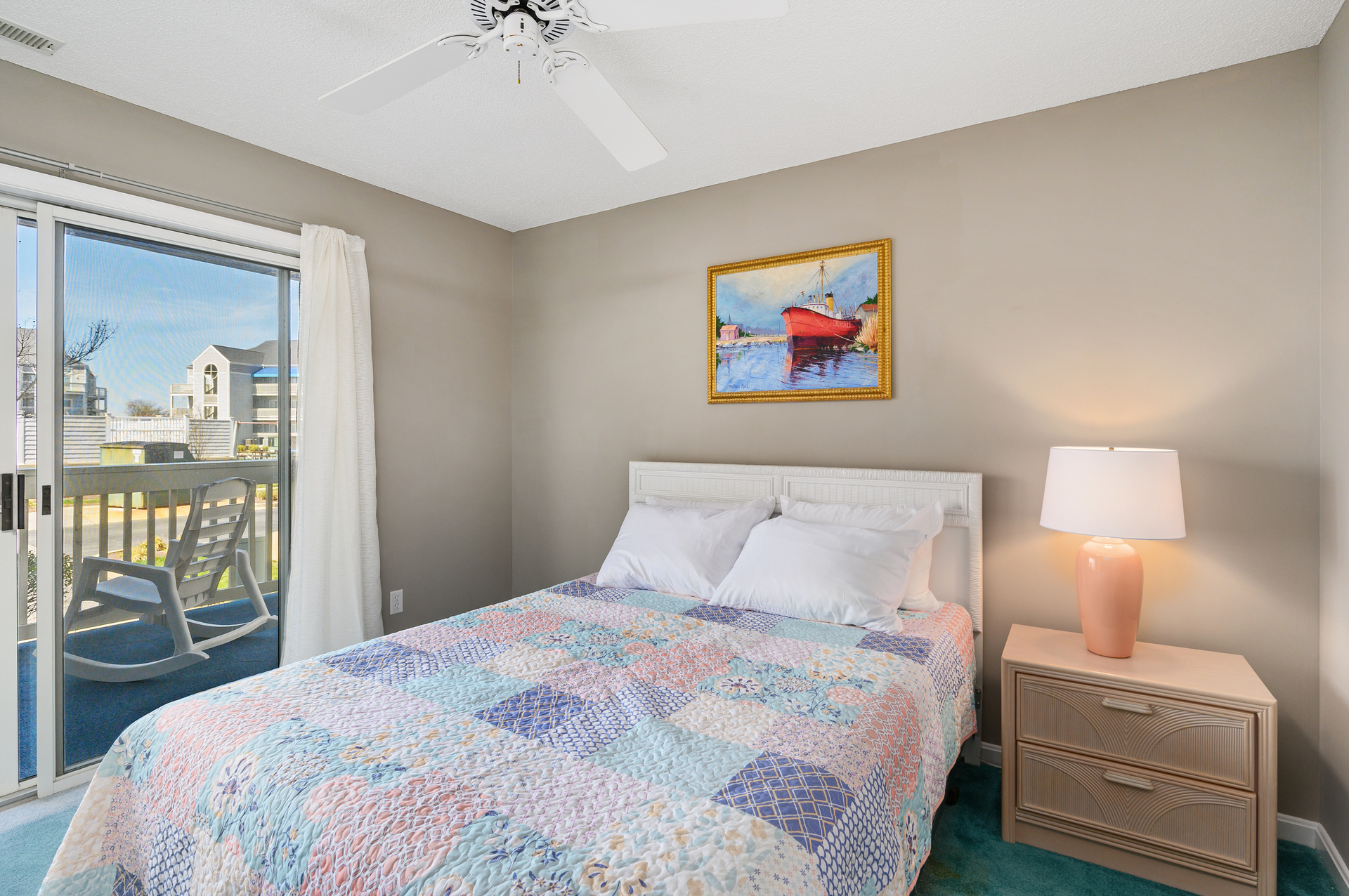 Bedroom 2 is a great space with a Queen Bed and access to the front patio