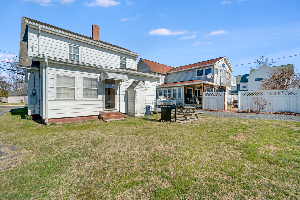 You'll love the spacious backyard with seating and gas grill.