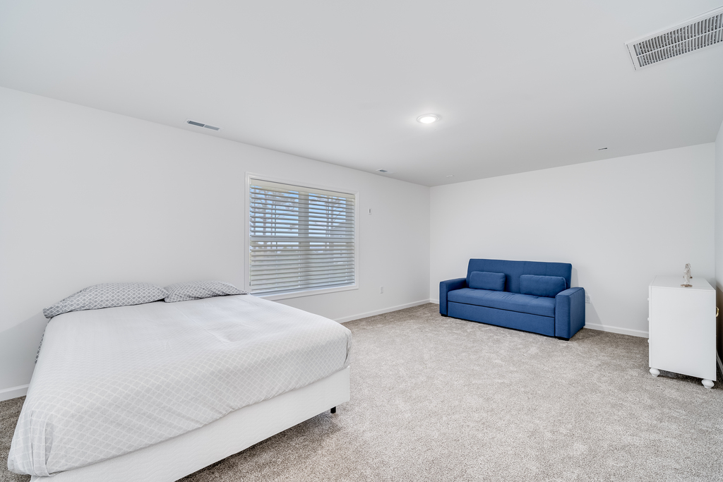 Bedroom 5 has a comfy Queen Bed and Sleeper Love Seat.