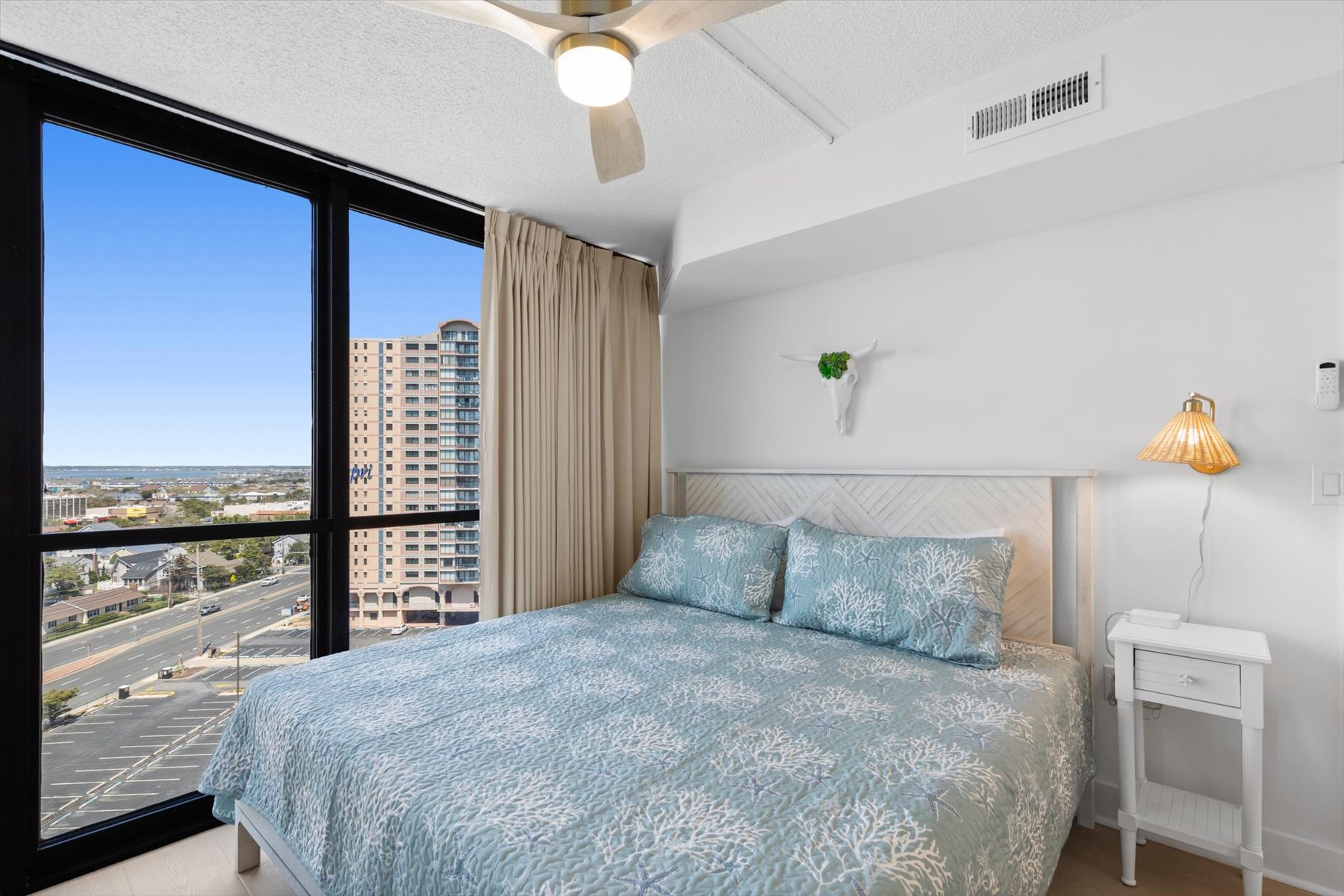 Serene and costal bedroom with King bed.