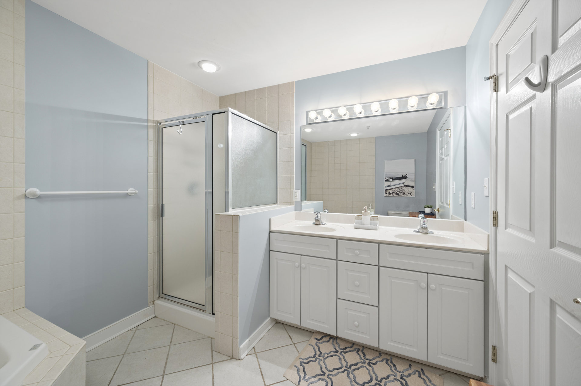 Primary Bath has Dual Vanity, Walk-in Shower, and Soaking Tub.