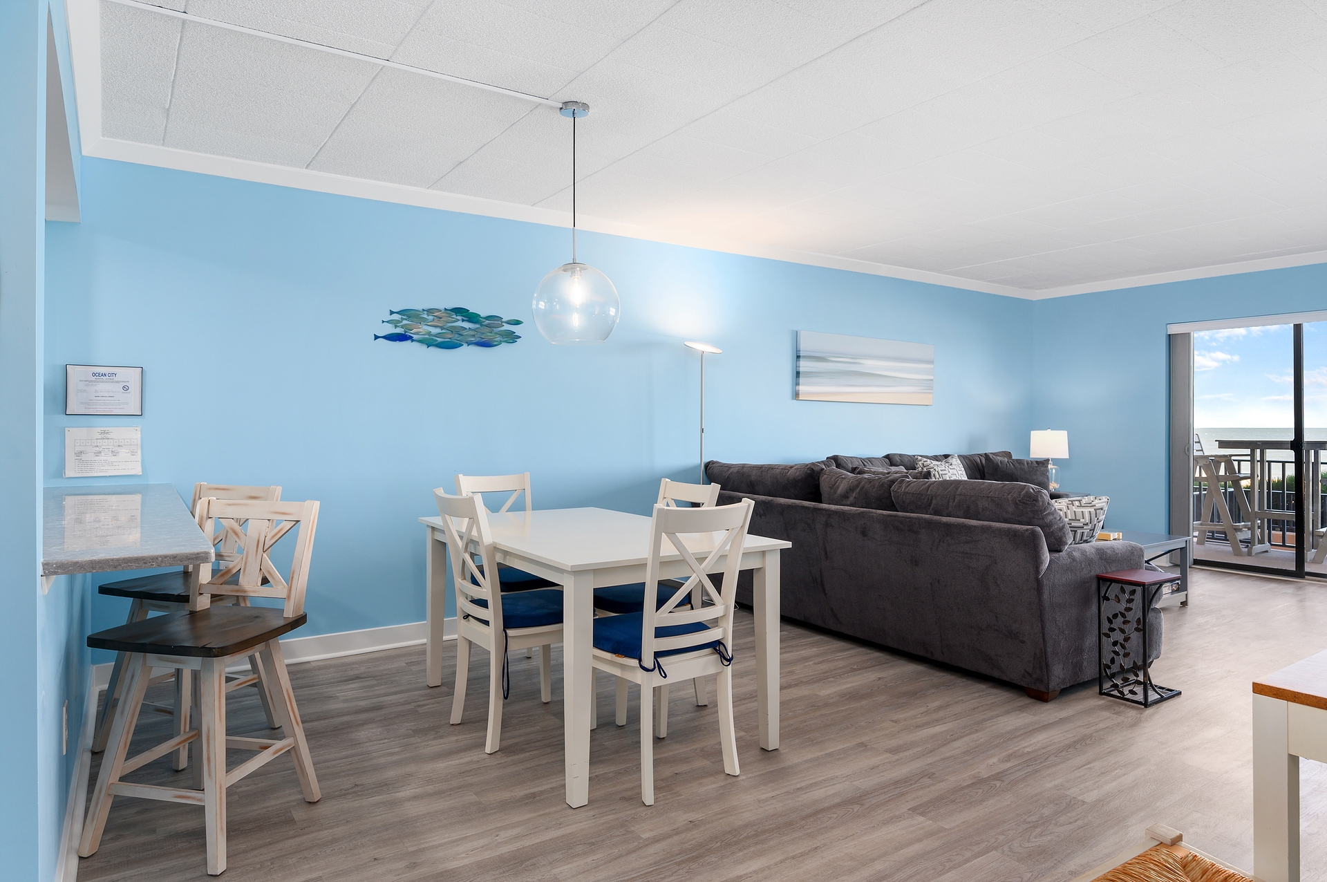 Everyone can gather for meal time at the dining table and the breakfast bar