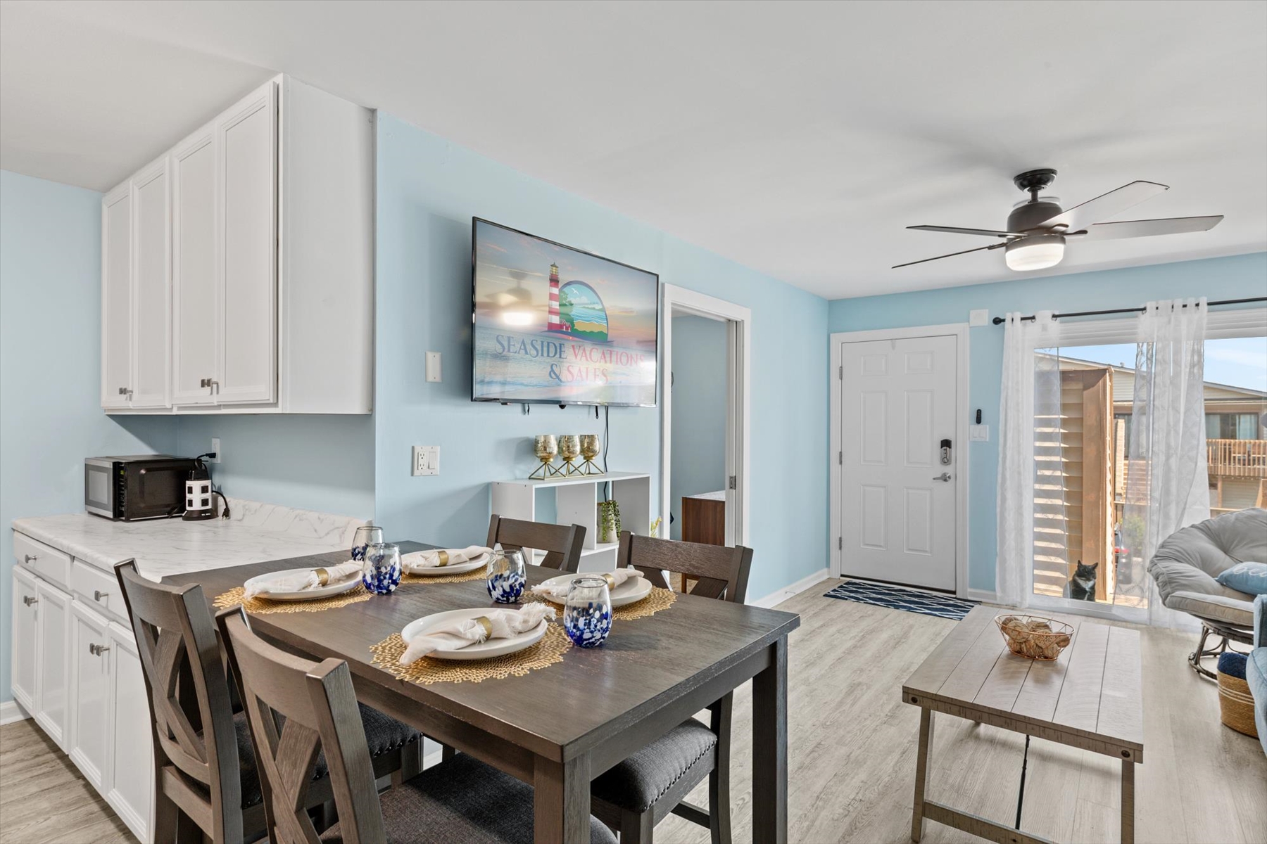 Enjoy your meals in a bright space that looks directly out across the living room toward the main entry.
