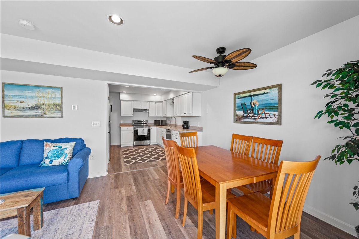 Living Area opens to Dining Area and Kitchen.