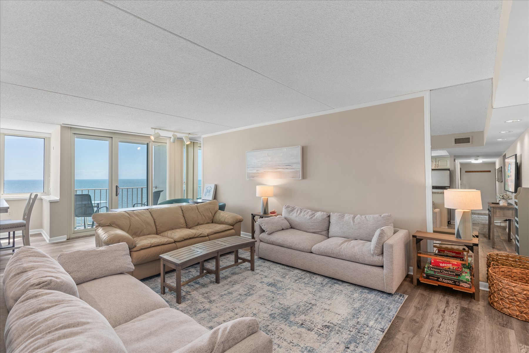 Relax on the comfortable plush sofas while enjoying the coastal breeze and serene atmosphere.
