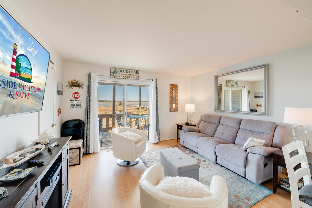Relax in the Living Area after a fun-filled day at the Beach with Free WiFi and Flat Screen Streaming TV.