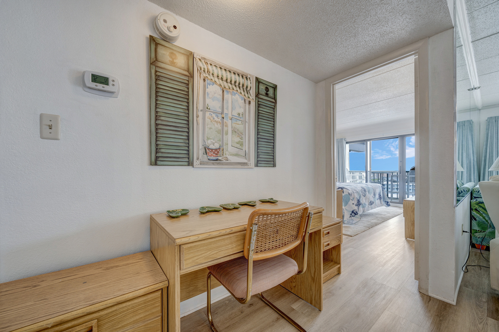 Need a quiet place to make a quick call or take care of some business? Utilize this charming desk space!