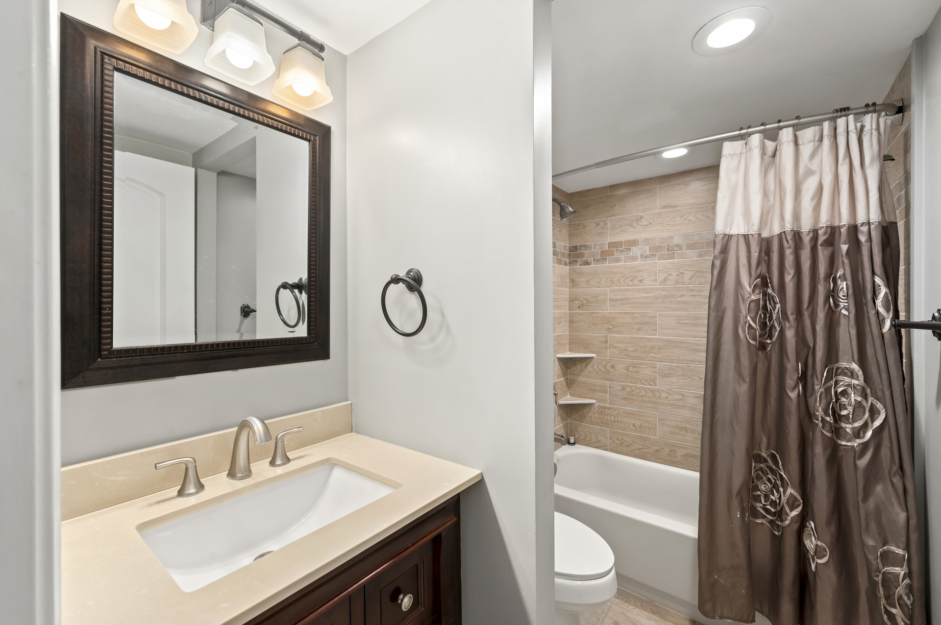 Full Shared Bath with a Shower/Tub Combo.