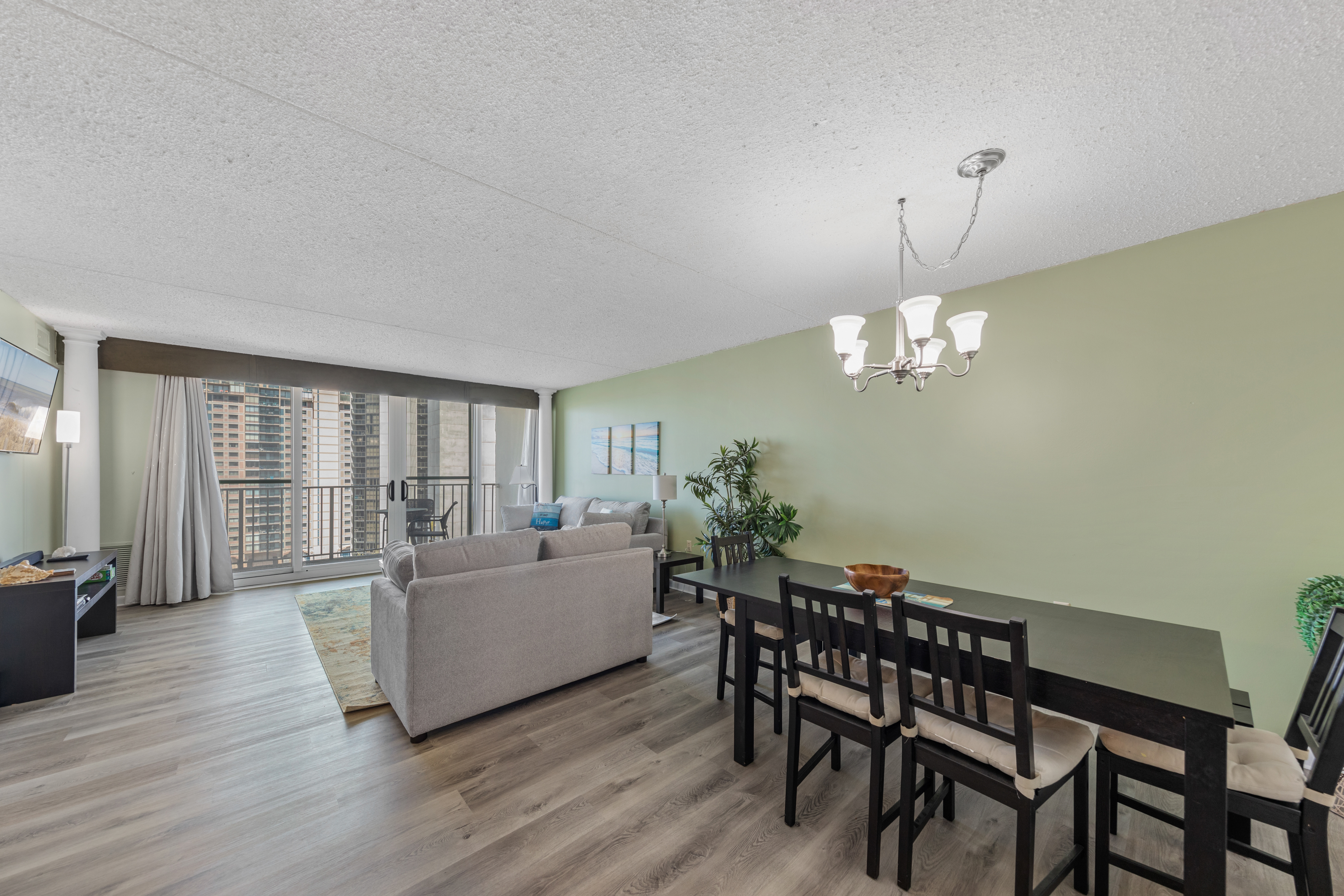 The soothing colors and Beachy plank floors kick off vacation in style