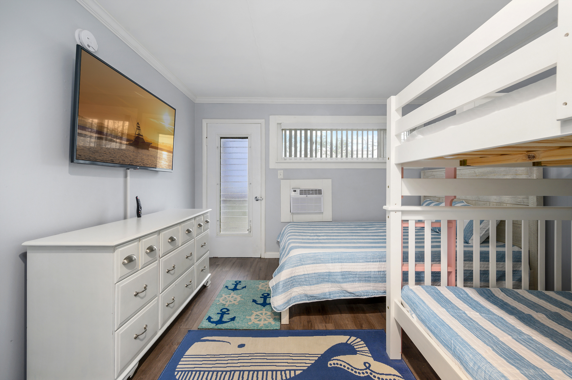 Bedroom with streaming large mounted tv