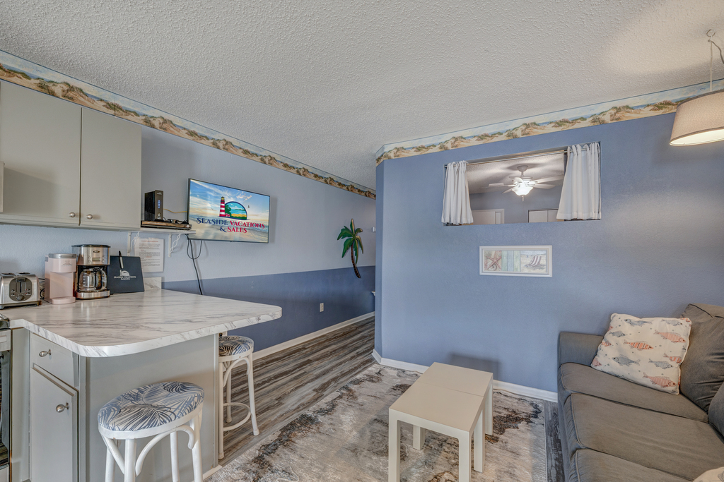 Grab a quick bite before hitting the beach while you enjoy the Flat Screen Smart TV.