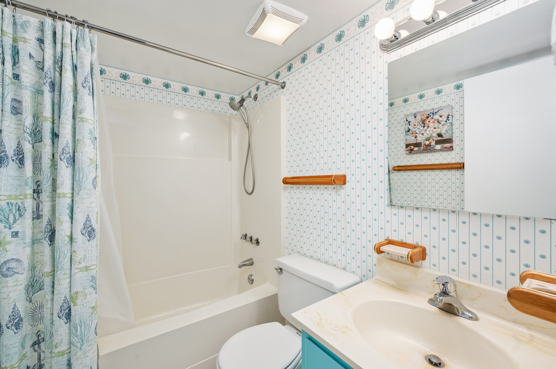 Shared Full Bath with a Shower/Tub Combo.