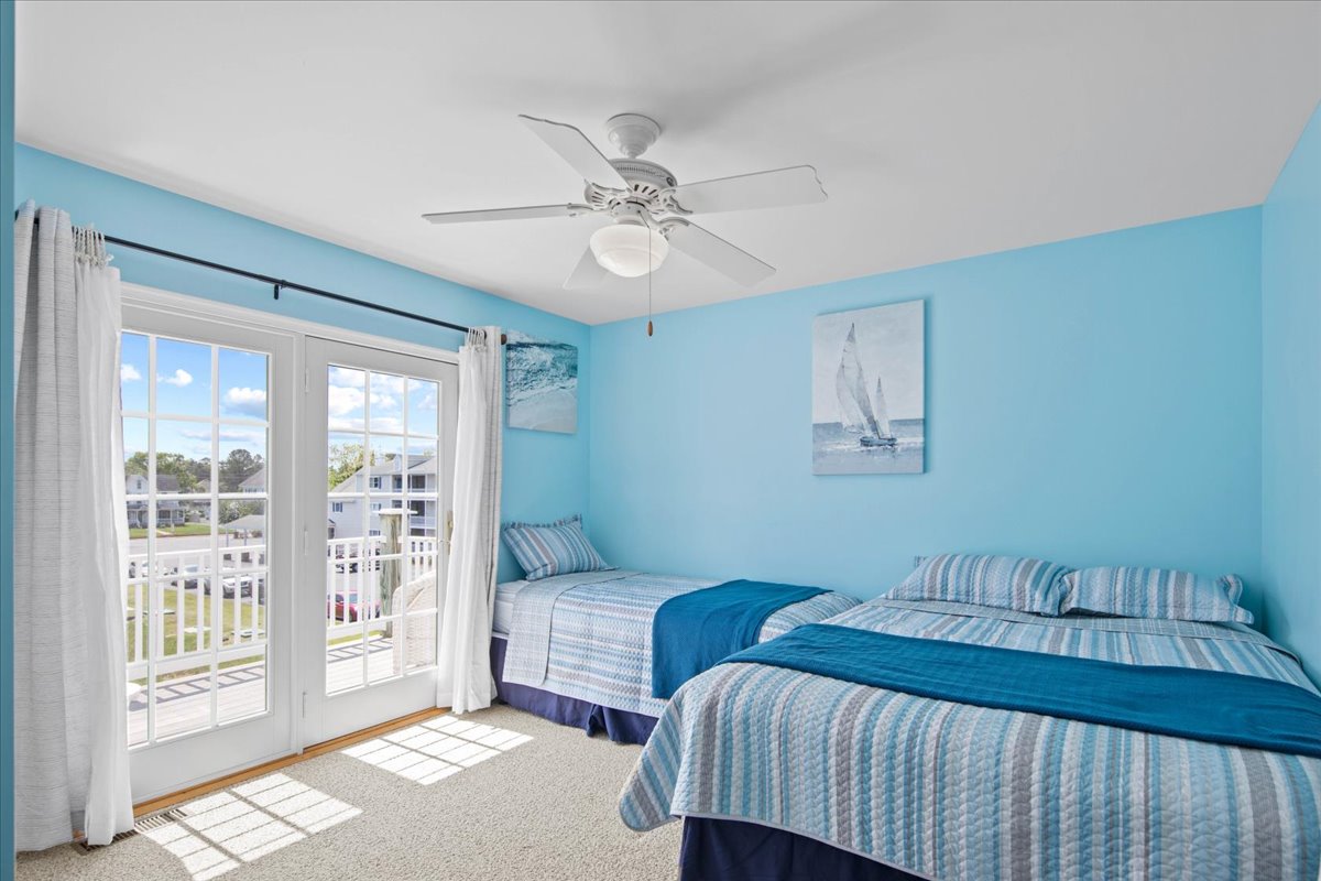 Bedroom 2 is beautifully blue and has a Twin Bed and a Full Bed.