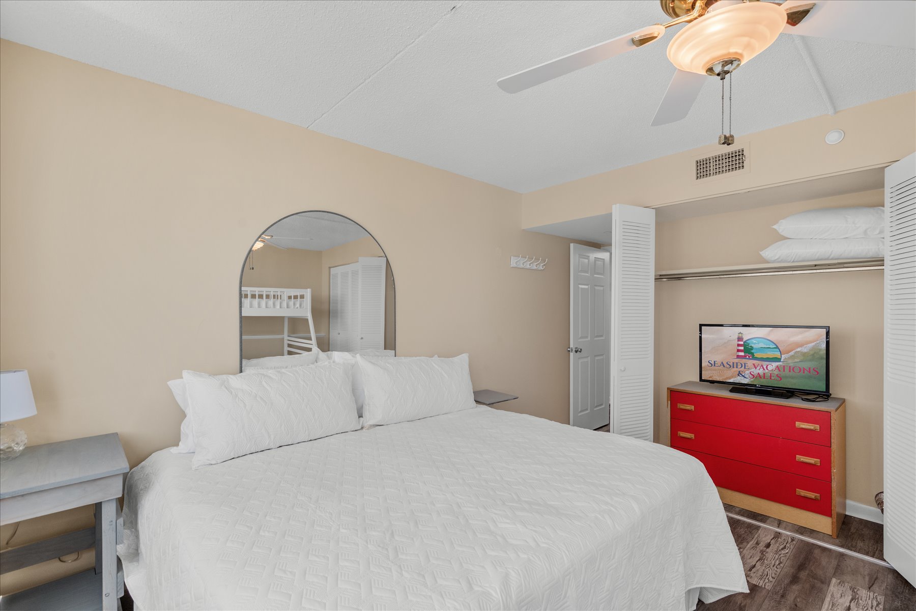 Rest comfortably in this beautifully arranged bedroom, offering a bright ambiance and plenty of space to relax.