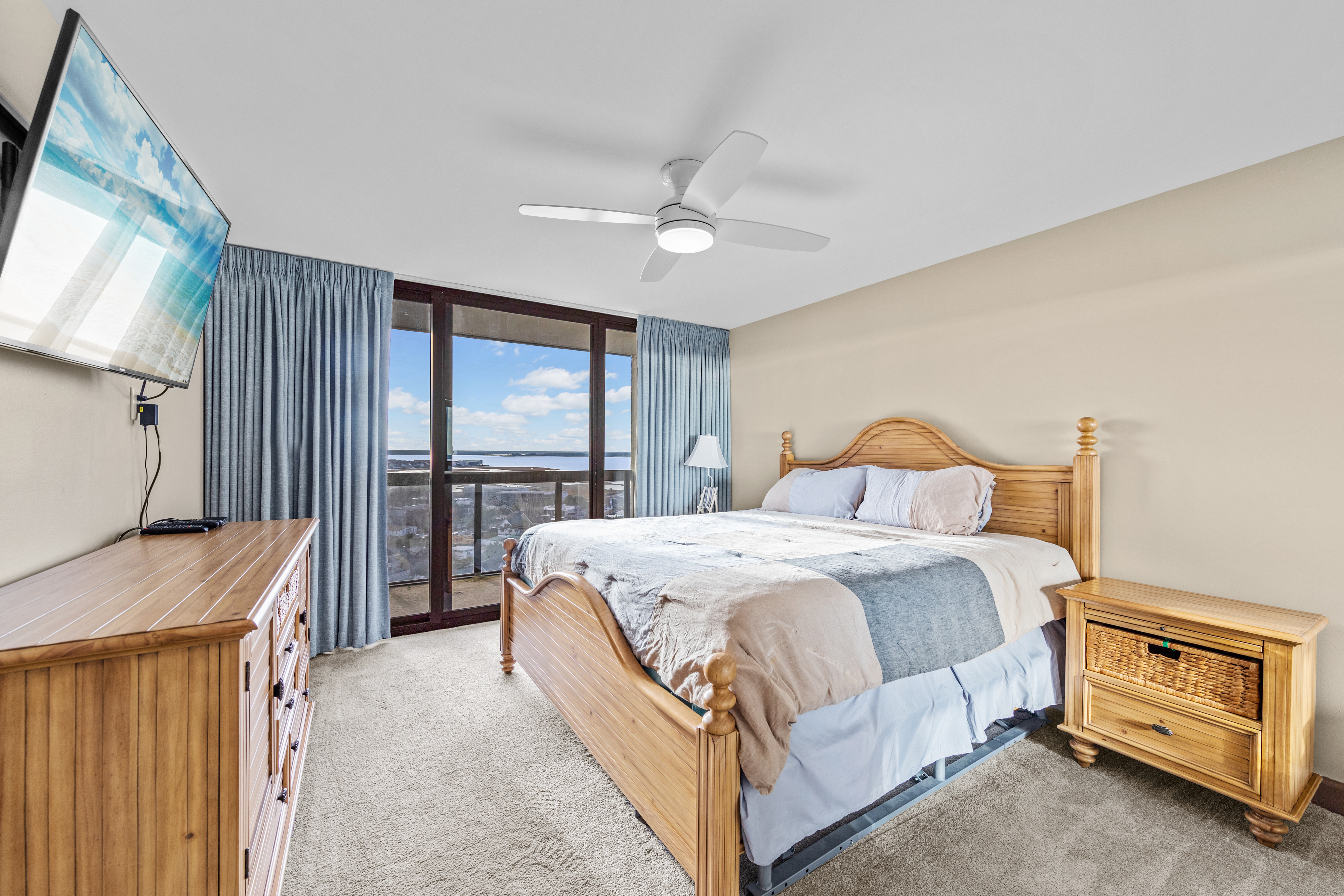 Bedroom 3 has floor to ceiling slider doors that lead to the balcony.