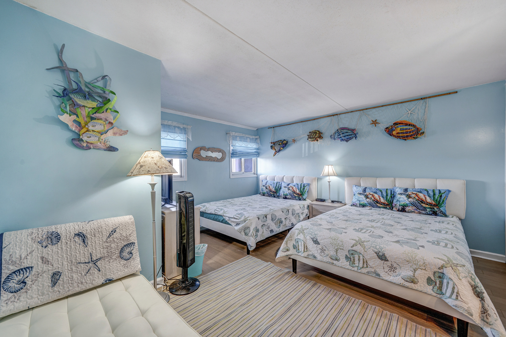 The Bedroom has 2 cozy Queen Beds!