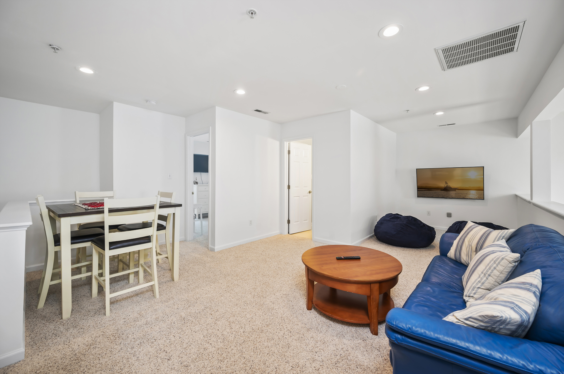 With a large Smart TV, Gaming hook up, bean bags and a game table, this loft area has it all!