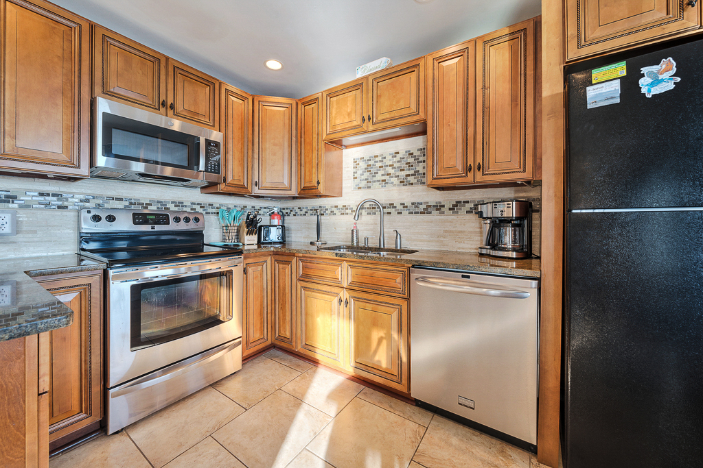 Stainless Appliances and lots of workspace.