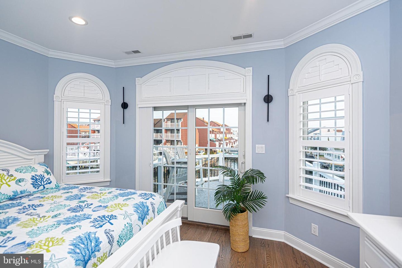 This Large Bedroom features Private Balcony Access and a Flat Screen TV.