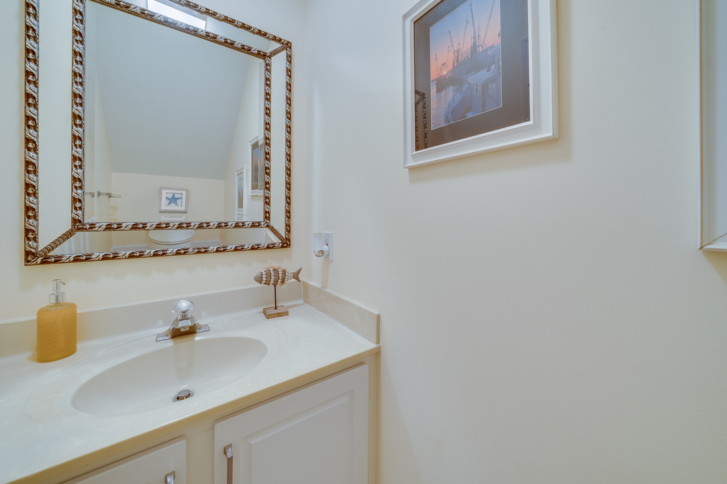 Convenient Half Bath just off Living Area and Kitchen.