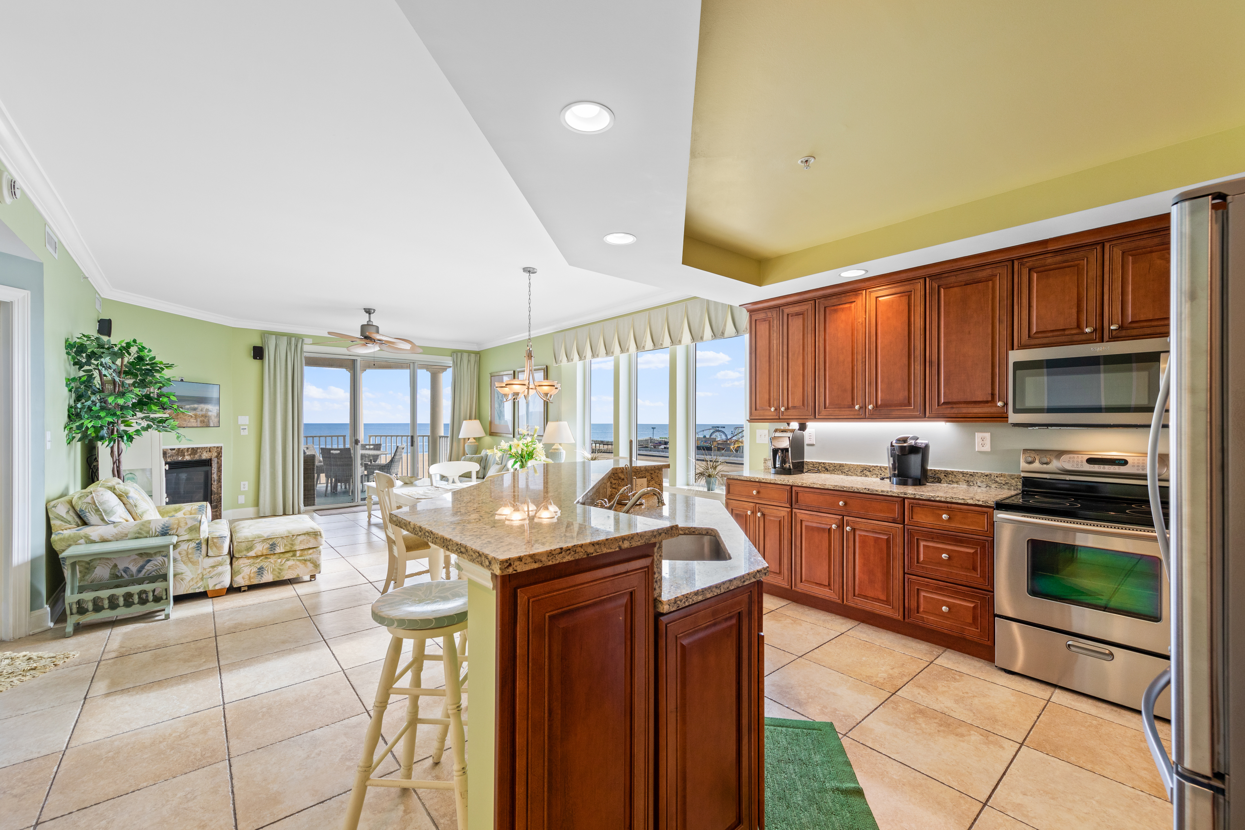 Check out this gorgeous kitchen that features granite countertops and solid wood cabinets.