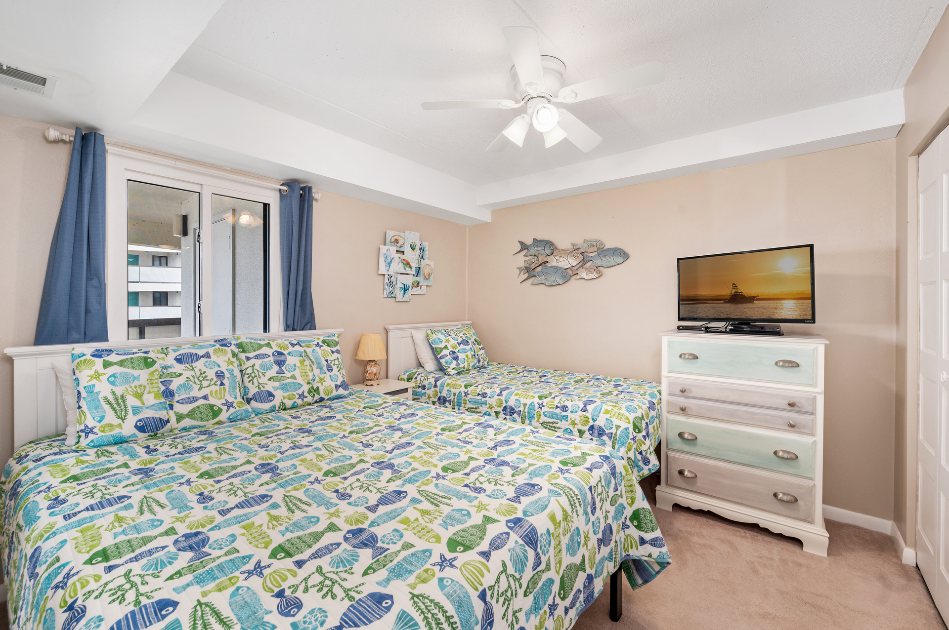 Bedroom 2 offers a Queen Bed & a Twin Bed.