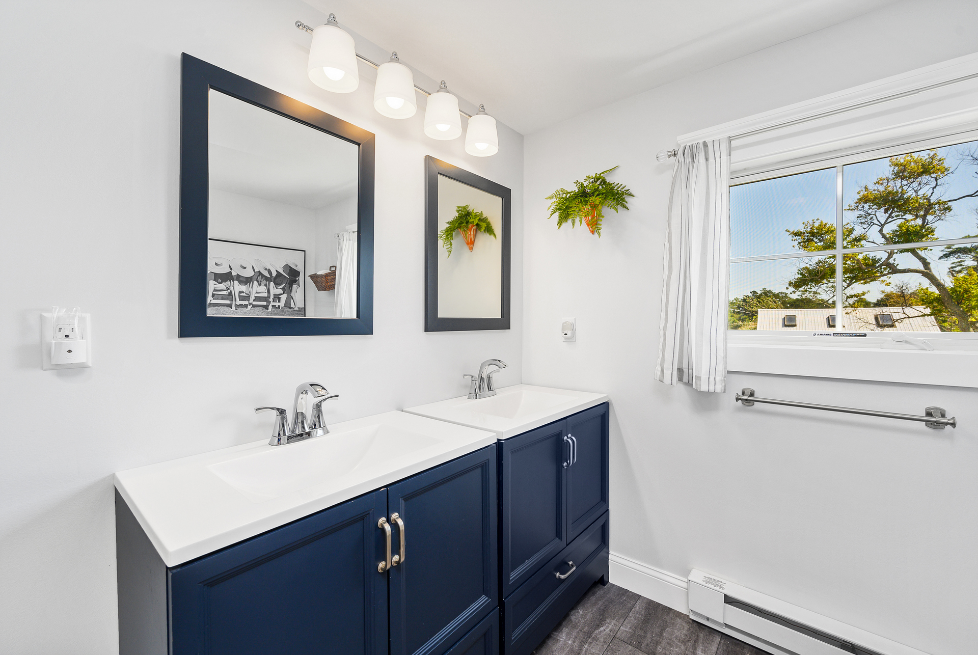 Full Bath with gorgeous Coastal Navy and White.