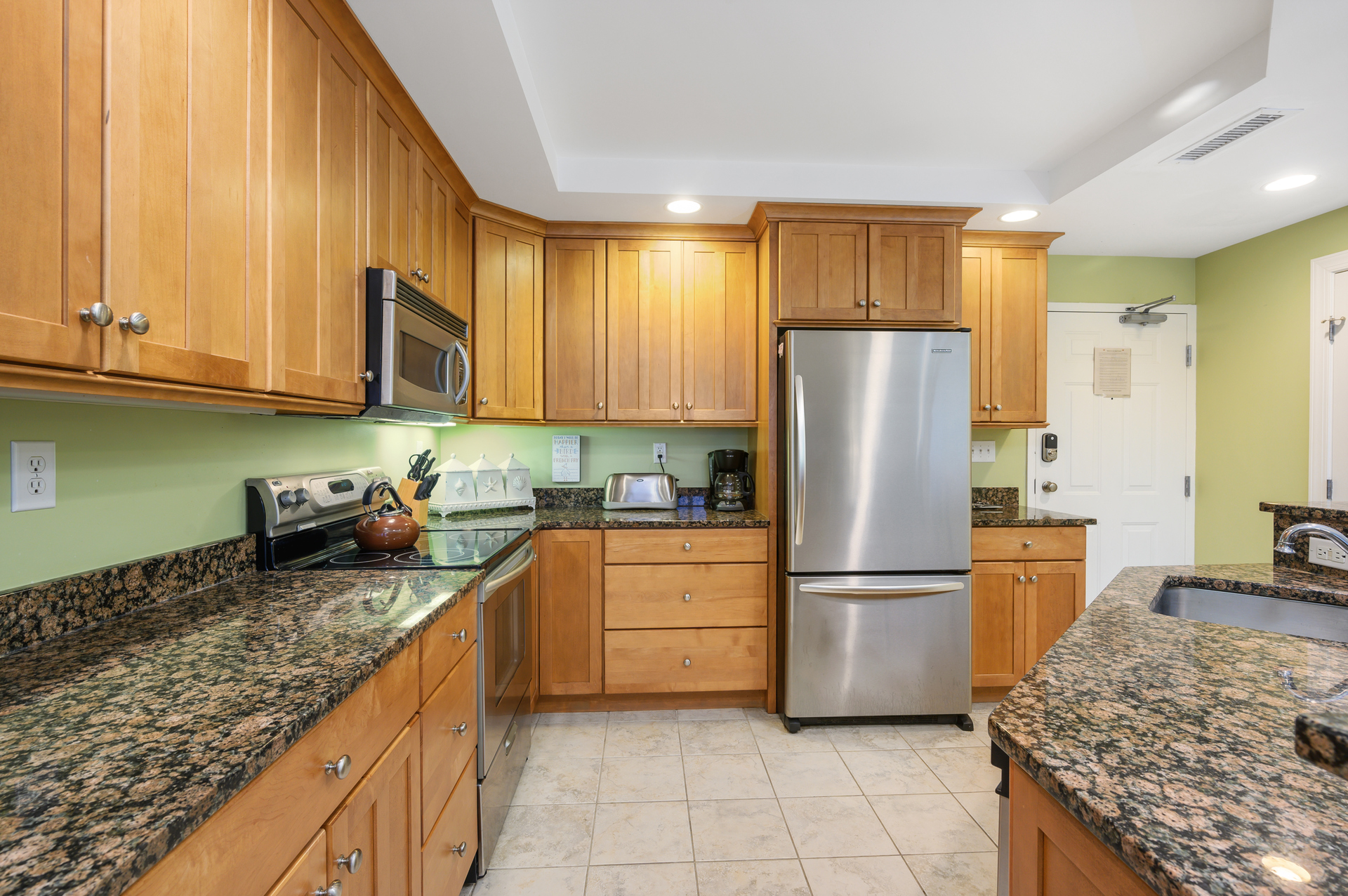 Gorgeous Granite and Stainless Steel make this Open Kitchen a Chef's dream!