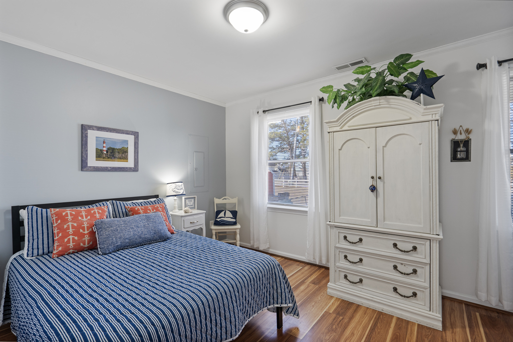 Bedroom 2 has a Queen Bed and cheerful colors.