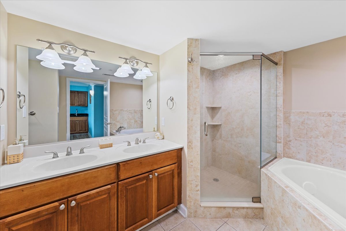 The Primary Bath is a Spa-Like Retreat with a Large, Walk-In Shower & Jacuzzi Tub.
