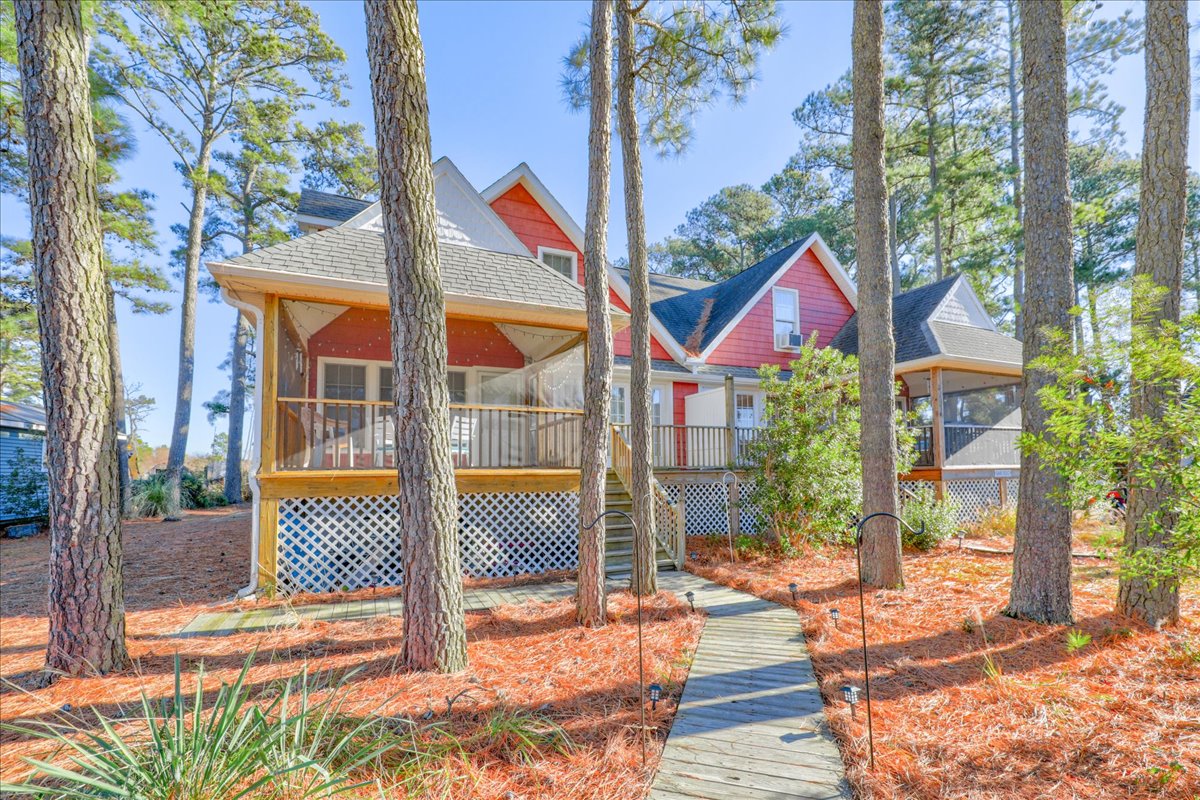 The Screened Porch lines the front of Whispering Pines.