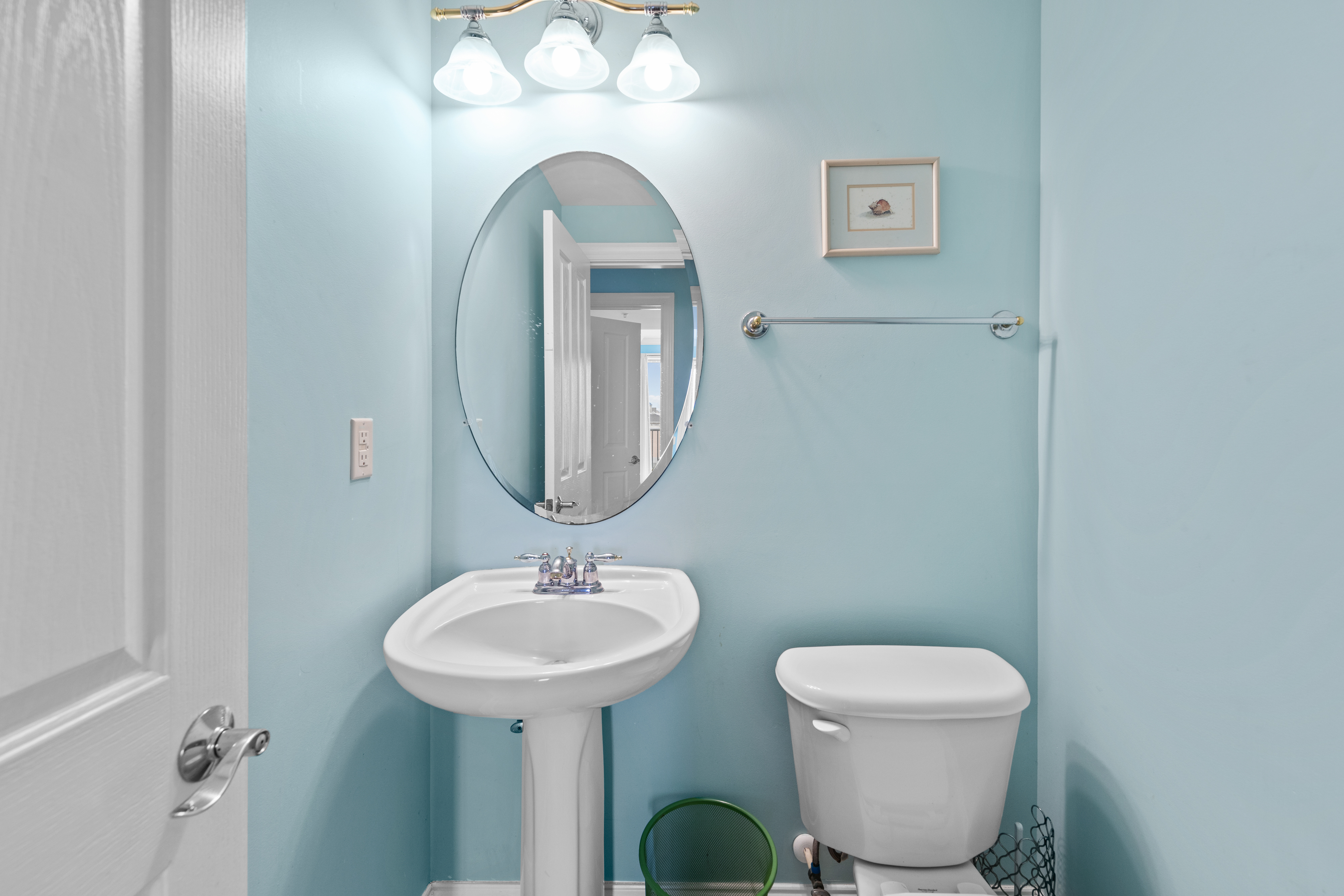 Convenient Half Bath located just off the Living & Kitchen Area.