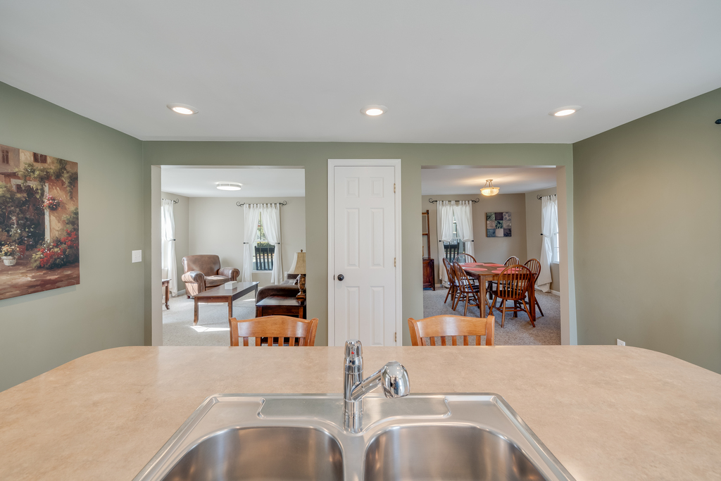 Looking from Kitchen towards Living Area on the left, and Dining Area on the right.